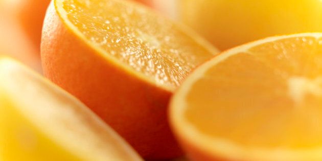 Close up of cut lemons and oranges