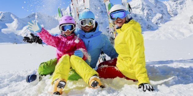 Skiing, winter, snow, skiers, sun and fun - family enjoying winter vacationsSkiing family winter, snow, skiers, sun and fun.