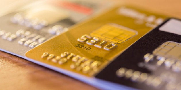 Cloesup view of credit cards in silver, gold and platinum black