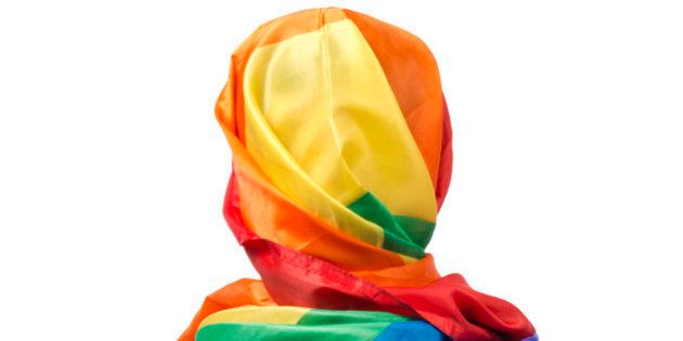 The human body wrapped in a gay flag which symbolises a muslim gay person.