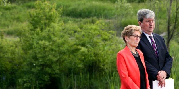 TORONTO, ON - JUNE 8 - Premier Kathleen Wynne and Environment Minister and Climate Change, Glen Murray (R) during the unveiling of Ontario's Five Year Climate Action Plan at Evergreen Brick Works, Toronto, ON, June 8, 2016. (Andrew Francis Wallace/Toronto Star via Getty Images)