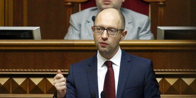 Ukrainian Prime Minister Arseniy Yatsenyuk addresses the Parliament in Kiev on June 17, 2014 on the results of the gas talks with Russia. Ukraine rushed on June 17 to assure a jittery public it would not suffer from Russia's latest gas cut and sent a team to Europe to bolster energy ties. Yatsenyuk said that a team headed by Kobolev and Energy Minister Yuriy Prodan was flying to Budapest to negotiate 'reverse-flow' deliveries along pipelines now used for transporting Russian gas west. AFP PHOTO/ ANATOLII STEPANOV (Photo credit should read ANATOLII STEPANOV/AFP/Getty Images)