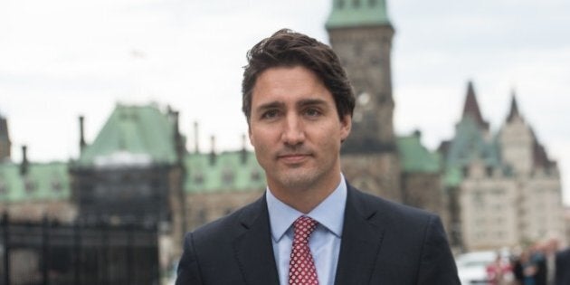 Canadian Liberal Party leader Justin Trudeau walks from the parliament to give a press conference in Ottawa on October 20, 2015 after winning the general elections. AFP PHOTO/NICHOLAS KAMM (Photo credit should read NICHOLAS KAMM/AFP/Getty Images)