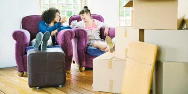 Women having coffee together in new home