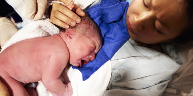 Mother with newborn baby just after giving birth