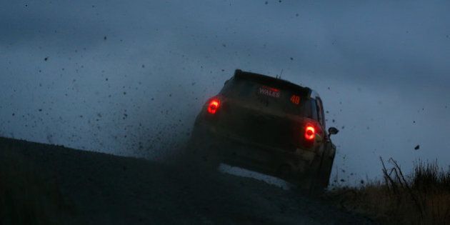 PONT RHYDGALED, WALES - NOVEMBER 13: Valeriy Gorban and Volodynyr Korsia of Ukraine pilot the Eurolamp WRT Mini John Cooper Works S2000 during the Myherin stage of the FIA World Rally Championship Great Britain on November 13, 2015 in Pont Rhydgaled, Wales. (Photo by Clive Rose/Getty Images)