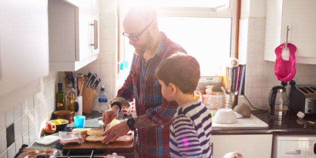 Dad making lunch for his children