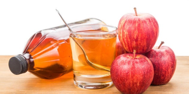 Apple cider vinegar in jar, glass and fresh apple, healthy drink.