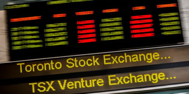 A sign board displaying Toronto Stock Exchange (TSX) stock information is seen in Toronto June 23, 2014. Canada's main stock index was little changed on Monday as weakness in financial and energy shares offset gains in the materials sector. REUTERS/Mark Blinch (CANADA - Tags: BUSINESS)