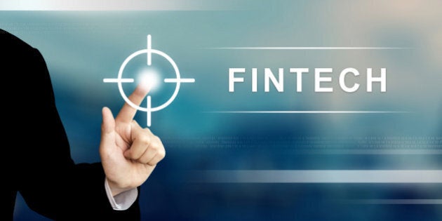 business hand pushing fintech or financial technology button on a touch screen interface