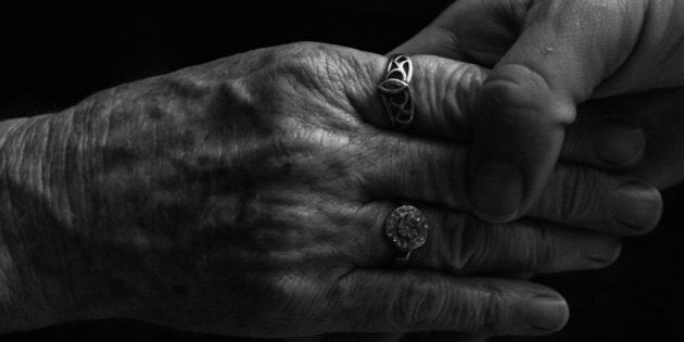 The young hands of a daughter softly holding the older hands of a mother,a precious bonding moment on Mothers Day.