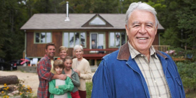 Portrait of Extended Family by Cottage