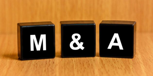 M&A or Merger and Acquisition text on black block