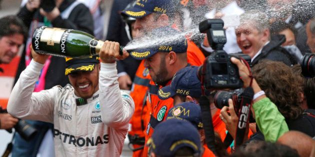 Formula One - Monaco Grand Prix - Monaco - 29/5/16. Mercedes F1 driver Lewis Hamilton celebrates after winning. REUTERS/Eric Gaillard