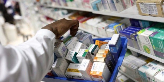 A pharmacist collects medications for prescriptions at a pharmacy in London, U.K., on Monday, Dec. 14, 2015. European pharmaceuticals stocks in 2015 have outperformed the Stoxx 600 Index by 1.2 percentage points in U.S. dollar terms. Photographer: Simon Dawson/Bloomberg via Getty Images