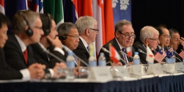US Trade Representative Mike Froman (C) speaks at a press conference for the Trans-Pacific Partnership (TPP), a pan-Pacific trade agreement by trade ministers from 12 nations in Sydney on October 27, 2014. The TPP, which would encompass 40 percent of the global economy and include 12 nations, has been the subject of negotiations for years. AFP PHOTO/Peter PARKS (Photo credit should read PETER PARKS/AFP/Getty Images)