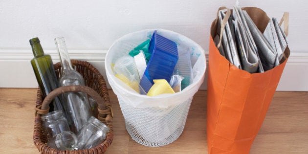 trash separated into glass plastic and paper