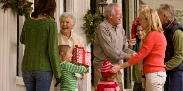 Family Greeting at Front Door for Christmas Party