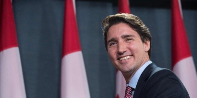 Canadian Liberal Party leader Justin Trudeau smiles at the end of a press conference in Ottawa on October 20, 2015 after winning the general elections. Liberal leader Justin Trudeau reached out to Canada's traditional allies after winning a landslide election mandate to change tack on global warming and return to the multilateralism sometimes shunned by his predecessor. AFP PHOTO/NICHOLAS KAMM (Photo credit should read NICHOLAS KAMM/AFP/Getty Images)