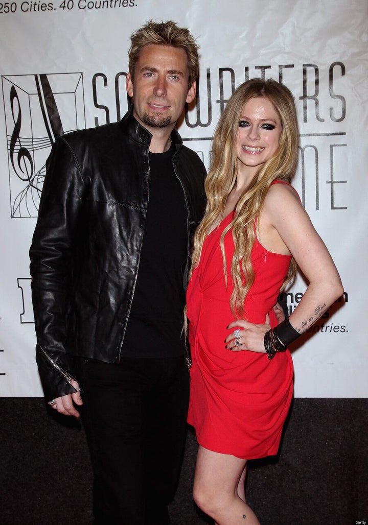 Avril Lavigne Teases Baby Bump Watchers With Draped Dress (PHOTOS