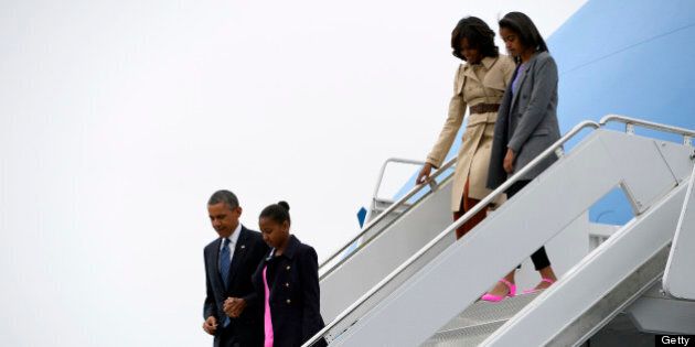 US President Barack Obama (L), First Lady Michelle Obama (2R) and their daughters Malia (2L) and Sasha (R) disembark from Air Force One at Aldergrove International Airport in Belfast, Northern Ireland on June 17, 2013 as Barack Obama prepared to attend the G8 summit in Lough Erne near Enniskillen. AFP PHOTO / JEWEL SAMAD (Photo credit should read JEWEL SAMAD/AFP/Getty Images)