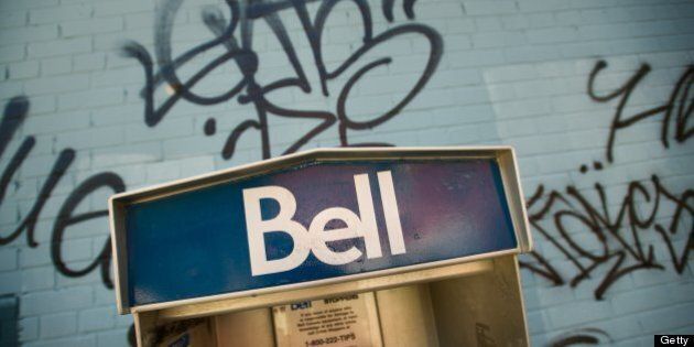 TORONTO, ON - JULY 16 : Bell Pay Phones may soon become a thing of the past now that the CRTC has denied raising the usage charge. Mobile phones have made pay phones somewhat obsolete, or severely underused. These two on the corner of Boston Avenue and Queen Street East stand against graffiti on a building wall. (Rick Madonik/Toronto Star via Getty Images)