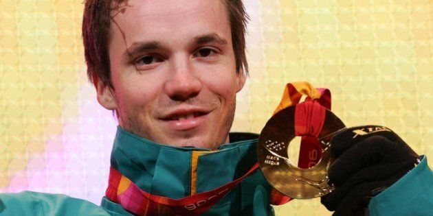 TURIN, ITALY - FEBRUARY 16: Dale Begg-Smith of Australia presents his gold medal during the Medals Ceremony during Turin 2006 Winter Olympic Games on February 16, 2006 at the Medals Plaza in Turin, Italy. (Photo by Vladimir Rys/Bongarts/Getty Images)