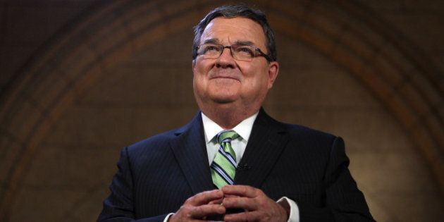 James 'Jim' Flaherty, Canada's finance minister, smiles while speaking during a press conference after releasing the 2014 Federal Budget on Parliament Hill in Ottawa, Ontario, Canada, on Tuesday, Feb. 11, 2014. Flaherty ramped up efforts to return the country to surplus in a budget that raises taxes on cigarettes and cuts benefits to retired government workers while providing more aid for carmakers. Photographer: Cole Burston/Bloomberg via Getty Images