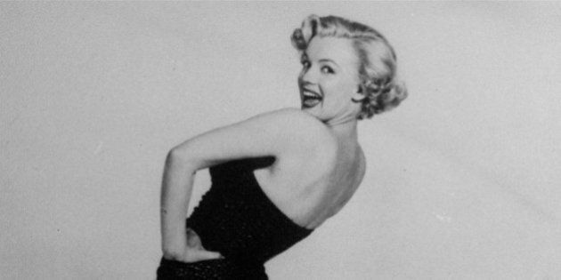 FILE - In this undated file photo, actress Marilyn Monroe is pictured mimicking Betty Grable's famous World War II pin-up pose. (AP Photo, File)