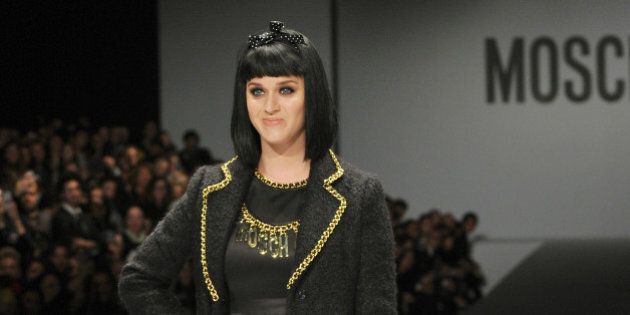 US singer Katy Perry attends the show for fashion house Moschino as part of the Milan's Women's fashion week Autumn/Winter 2014 collections on February 20, 2014. AFP PHOTO / TIZIANA FABI (Photo credit should read TIZIANA FABI/AFP/Getty Images)