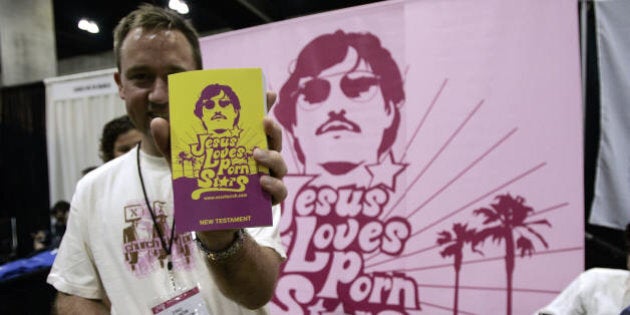 Los Angeles, UNITED STATES: Members of the XXXChurch a Christian-faith group distribute the 'bible' during the 10th Annual Erotica LA in Los Angeles Convention Center 23 June 2006. The Convention groups hundreds of adult entertainers, production companies, strip clubs and small bussineses that manufacture sex toys and other paraphernalia. AFP PHOTO / HECTOR MATA (Photo credit should read HECTOR MATA/AFP/Getty Images)