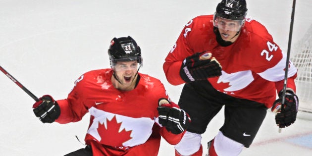 Sochi, Russia - February 21 - SSOLY- In second period action, Jamie Benn (22) scores the first goal of the game and celebrates with Corey Perry.At the Winter Olympics in Sochi, Canada's men's hockey team took on team USA in semi-final action at the Bolshoy ice palace.February 21, 2014 (Richard Lautens/Toronto Star via Getty Images)