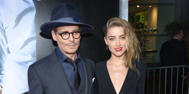 Johnny Depp, left, and Amber Heard arrive at the US premiere of