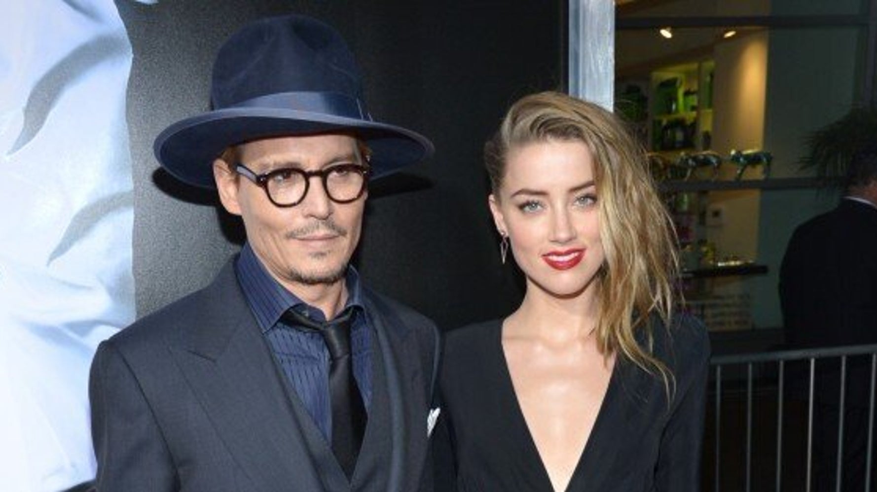 sachin and babi light blue dress Johnny Depp and Amber Heard at 3 Days to Kill premiere main image 0
