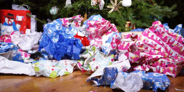A Mess of Wrinkled Wrapping Paper Scattered Under the Christmas Tree