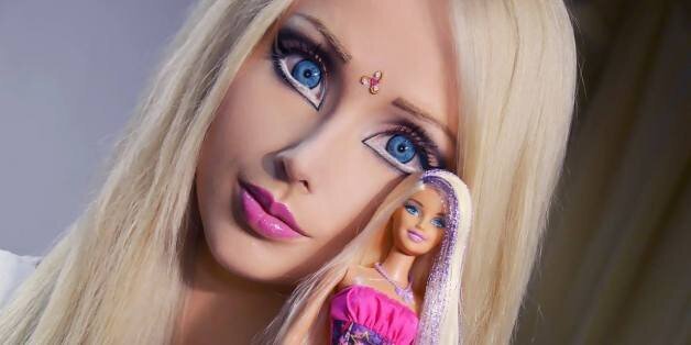 human barbie doll takes off her makeup