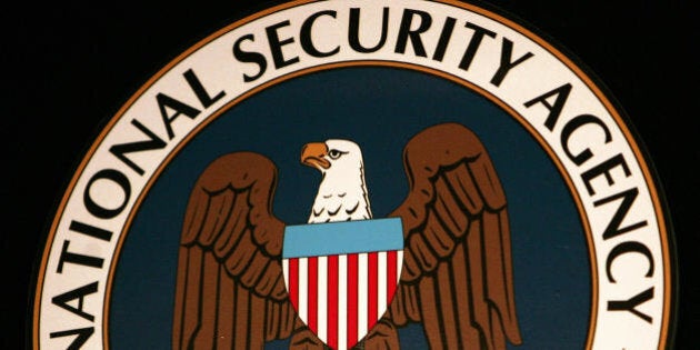 Fort Meade, UNITED STATES: The logo of the National Security Agency (NSA) hangs at the Threat Operations Center inside the NSA in the Washington suburb of Fort Meade, Maryland, 25 January 2006. US President George W. Bush delivered a speech behind closed doors and met with employees in advance of Senate hearings on the much-criticized domestic surveillance. AFP PHOTO/Paul J. RICHARDS (Photo credit should read PAUL J. RICHARDS/AFP/Getty Images)