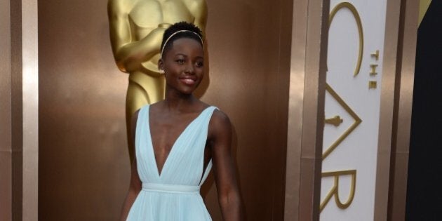 Nominee for Best Supporting Actress in '12 Years a Slave' Lupita Nyong'o arrives on the red carpet for the 86th Academy Awards on March 2nd, 2014 in Hollywood, California. AFP PHOTO / Robyn BECK (Photo credit should read ROBYN BECK/AFP/Getty Images)