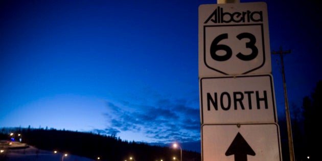 FORT MCMURRAY, ALBERTA, CANADA - NOVEMBER 2008: Trucks and cars can be seen continuously driving along highway A63 on the way to and from the oil refineries and tar sands mines. Tar sands, or oil sands, are very dense and contain a form of petroleum The world's largest reserves of tar sands in Canada and Venezuela. Tar sands could equate to approximately two thirds of the total global petroleum resource. Until recently it was financially not viable to extract the oil from the sands, but new technology and rising oil prices have now made it viable. (Photo by Veronqiue de Viguerie/Edit by Getty Images)