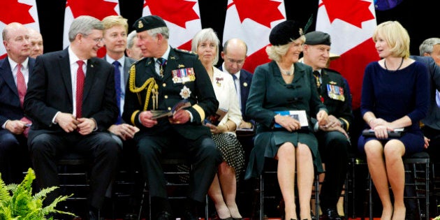 Britain's Prince Charles talks with Canada's Prime Minister Stephen Harper (L) while Duchess of Cornwall Camilla (2nd R) speaks with Harper's wife Laureen (R) at the Fort York Armoury for the 1812 Commemorative Military Muster in Toronto, May 22, 2012. The Prince of Wales and his wife Camilla, the Duchess of Cornwall, are on a three-day royal tour of Canada as part of the events that mark the Queen's Diamond Jubilee 2012. AFP PHOTO / Pool / Mark Blinch (Photo credit should read MARK BLINCH/AFP/GettyImages)