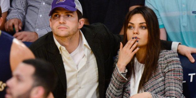LOS ANGELES, CA - MARCH 04: Ashton Kutcher (L) and Mila Kunis attend a basketball game between the New Orleans Pelicans and the Los Angeles Lakers at Staples Center on March 4, 2014 in Los Angeles, California. (Photo by Noel Vasquez/GC Images)