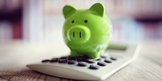 Piggy bank on calculator concept for saving, accounting, banking and business account