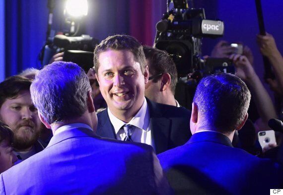 Andrew Scheer is congratulated after winning the Tory leadership in Toronto on May 27, 2017.