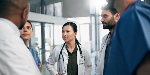 Shot of a diverse team of doctors having a discussion