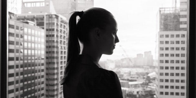 Thoughtful young business woman (black and white portrait).