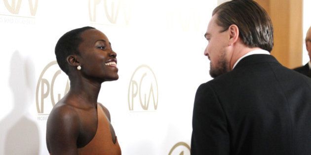BEVERLY HILLS, CA - JANUARY 19: Actress Lupita Nyong'o and actor Leonardo DiCaprio attend the 25th annual Producers Guild Awards at The Beverly Hilton Hotel on January 19, 2014 in Beverly Hills, California. (Photo by Jason LaVeris/FilmMagic)