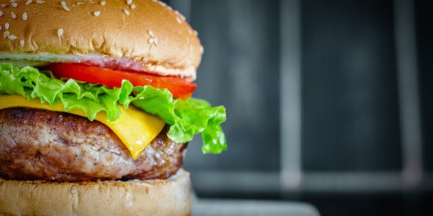 Tasty grilled beef Burger on wood background