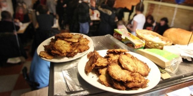 December 4, 2010 Latkes await distribution to the deli for judging. Caplansky's Deli hosts the second Round of their Bubbie Battle: Latkepalooza. Six teams cooked their best potato pancakes in the restaurant at the Hanukah event. Contestants brought a huge amount of Latkes in, every one in the deli had the opportunity to taste and judge. in Toronto. STEVE RUSSELL for the TORONTO STAR (Photo by Steve Russell/Toronto Star via Getty Images)