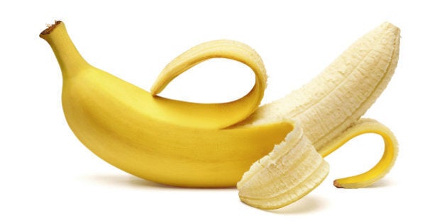 Peeled banana on white background