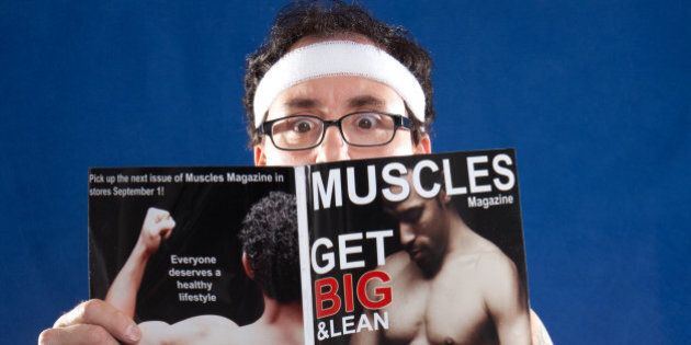 'A man with his belly hanging out, reading a muscle magazine. Fictitious magazine created by the photographer. Images featured on magazine: File #1667144 & 1745058.'